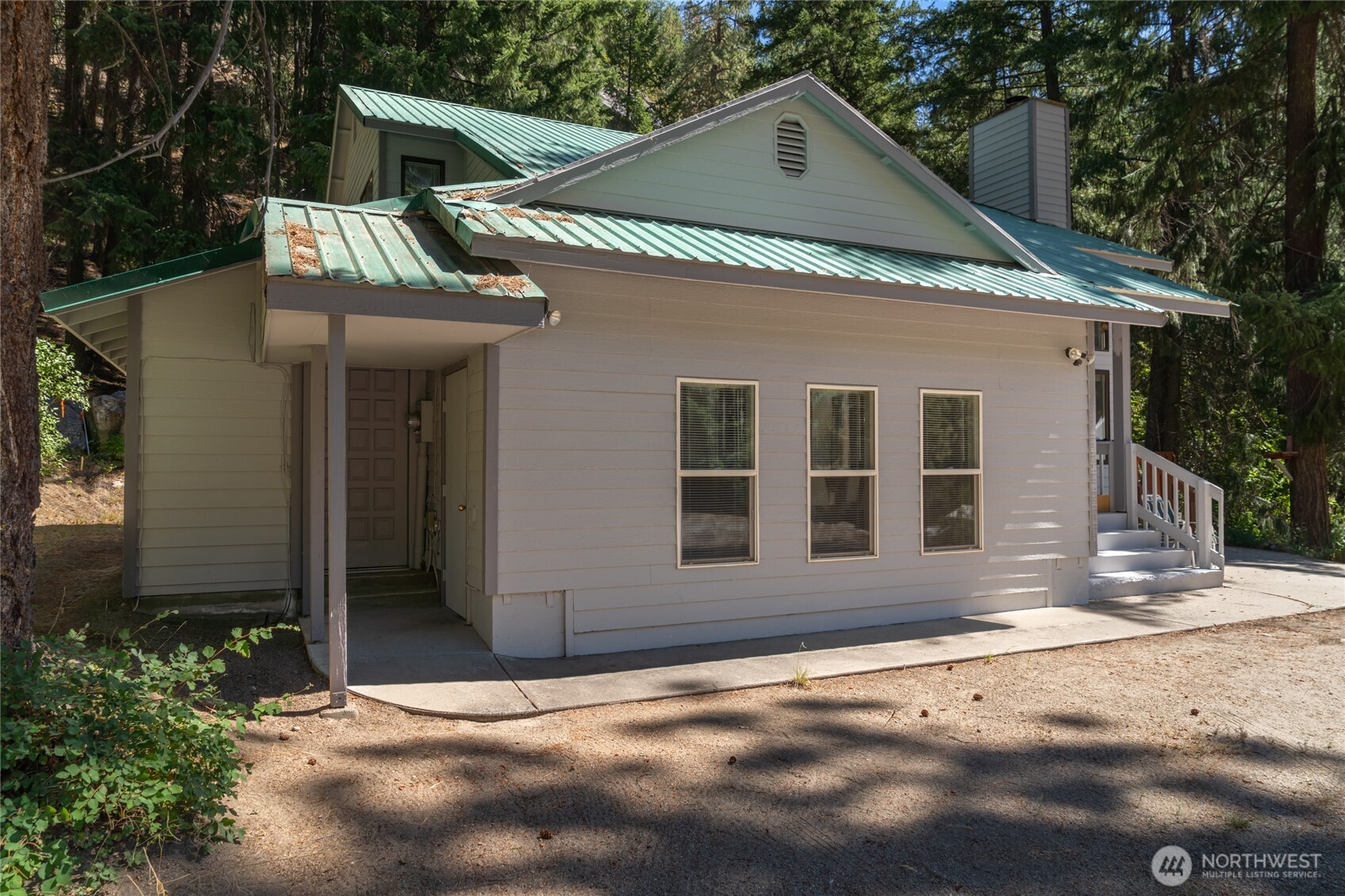 17976 Entiat River Road Entiat, WA 98822 - Photo 6 of 40 a view of an house with backyard and trees