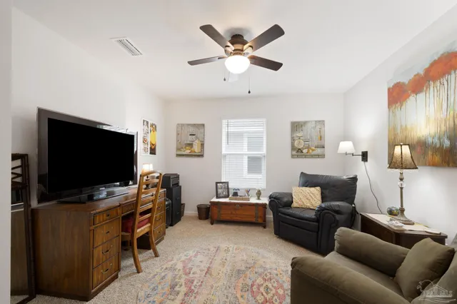 a view of walk in closet with clothes