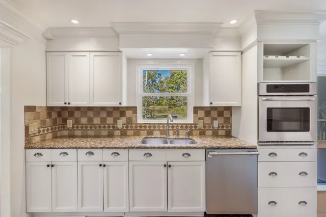 a white bath tub sitting next to a white sink