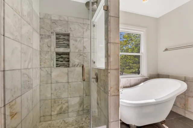 a view of a livingroom with furniture and a window