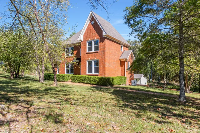 a view of a balcony with wooden floor