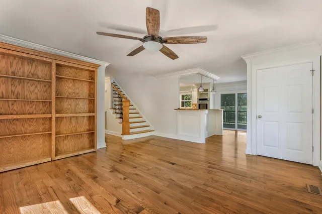 a large kitchen with granite countertop a large counter top stainless steel appliances and cabinets