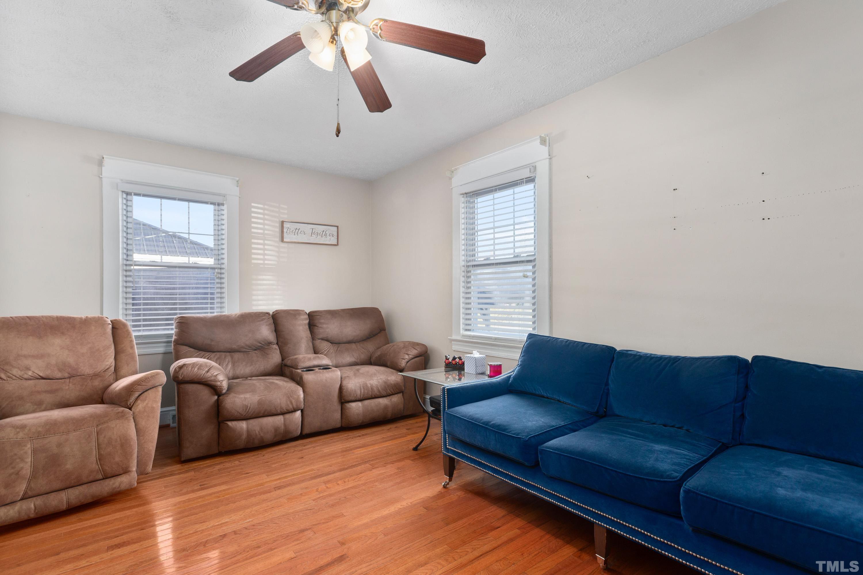 213 Edgar Street Roxboro, NC 27573 - Photo 11 of 29 a living room with furniture and a window