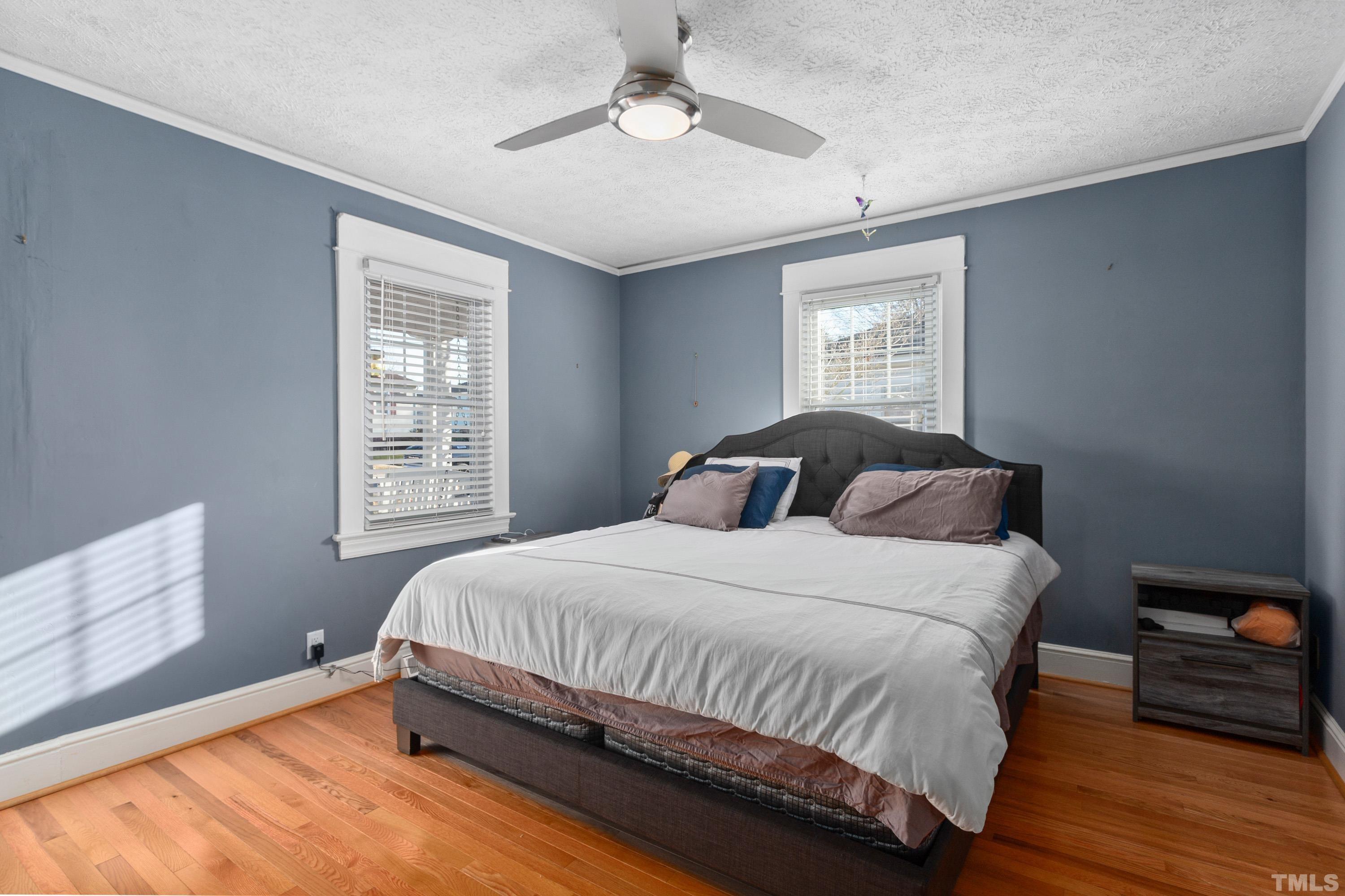 213 Edgar Street Roxboro, NC 27573 - Photo 13 of 29 a bedroom with a bed and window