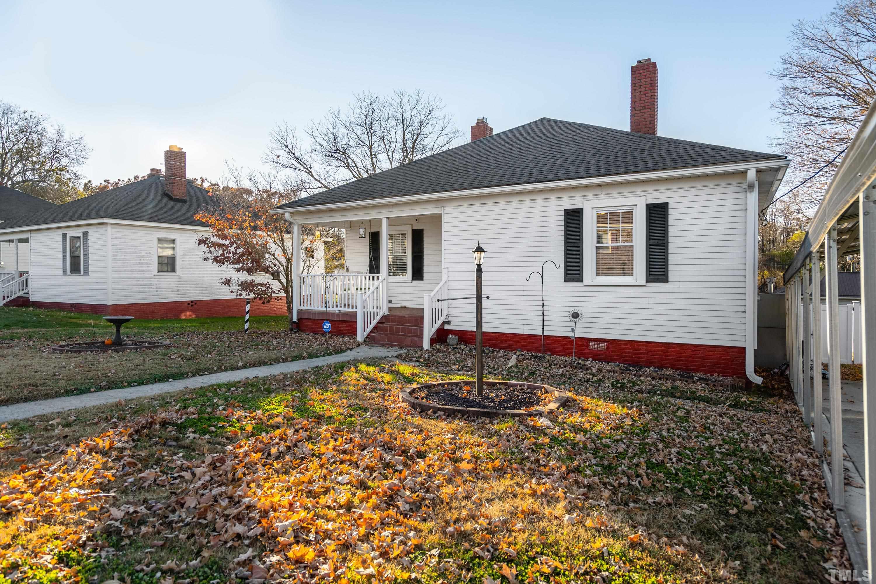 213 Edgar Street Roxboro, NC 27573 - Photo 5 of 29 a front view of a house with a yard