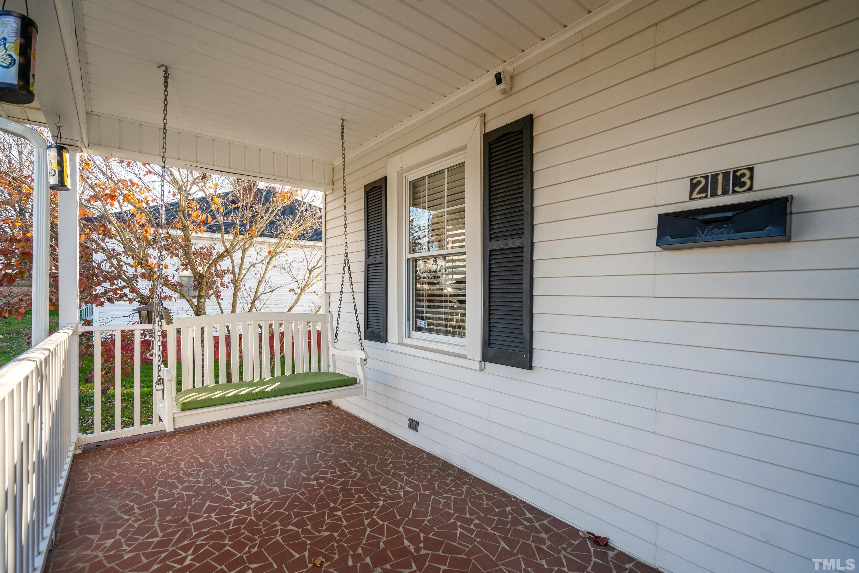 213 Edgar Street Roxboro, NC 27573 - Photo 8 of 29 a view of a porch with wooden floor and outdoor space