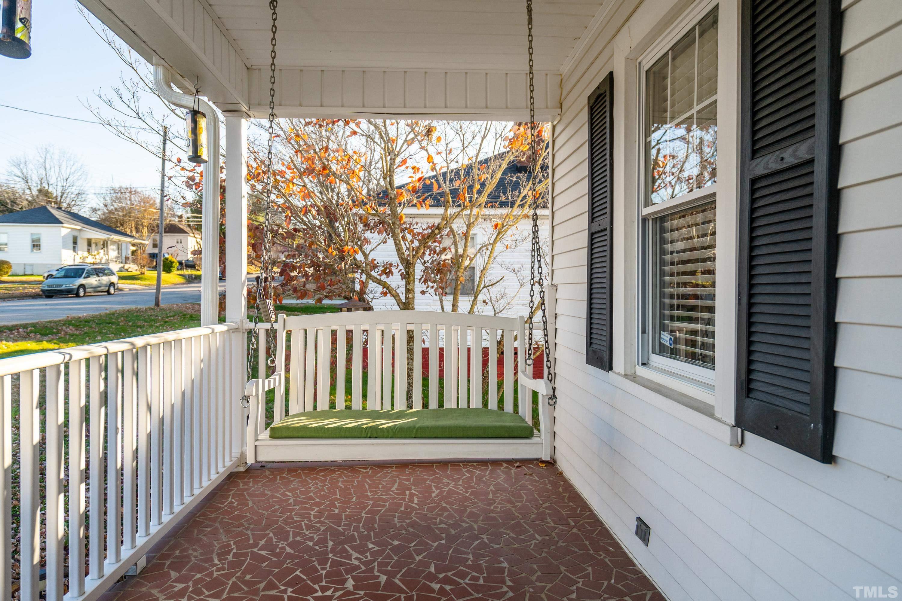 213 Edgar Street Roxboro, NC 27573 - Photo 9 of 29 a view of a porch with a floor to ceiling window