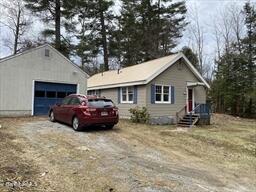 106 Shore Road Becket, MA 01223 - Photo 2 of 25 a front view of a house with a yard