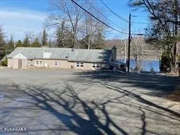a street sign on a sidewalk next to a road
