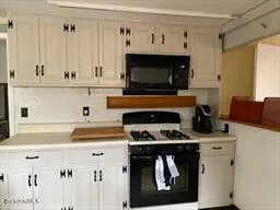 a kitchen with stainless steel appliances a stove and a refrigerator
