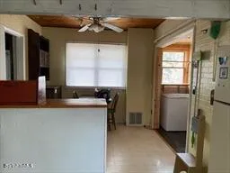 a kitchen with a refrigerator and a sink