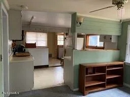 a kitchen with cabinets and window