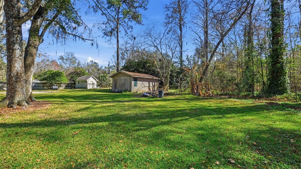 10565 Bessemer Street New Port Richey, FL 34654 - Photo 72 of 72 a view of a house with a yard