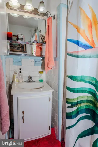 a utility room with cabinets and washer