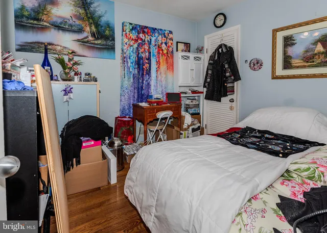 a bedroom with bed and a view of bathroom