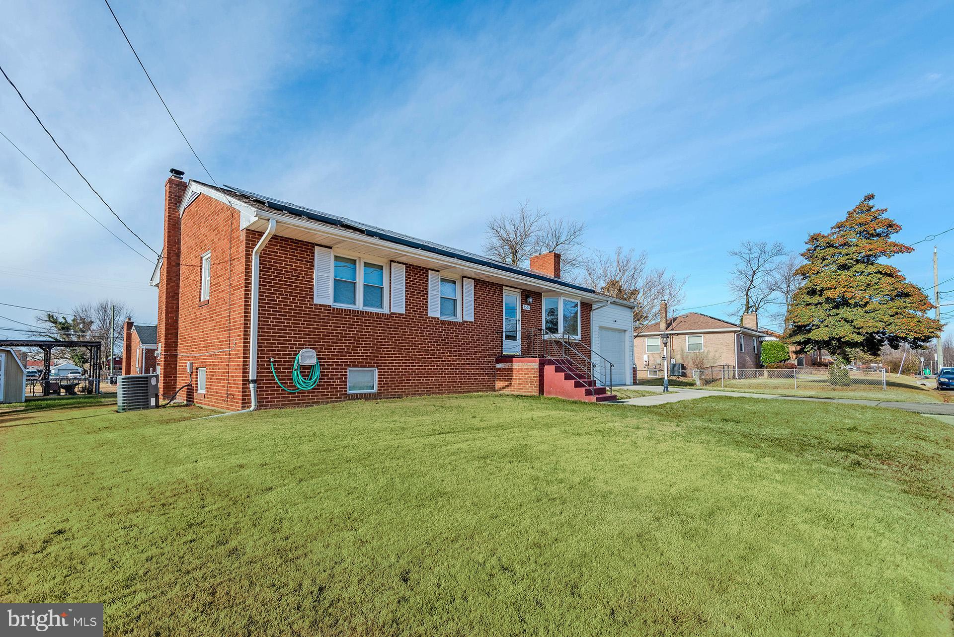 3505 South Forest Edge Road District Heights, MD 20747 - Photo 2 of 16 a front view of house with yard and trees in the background