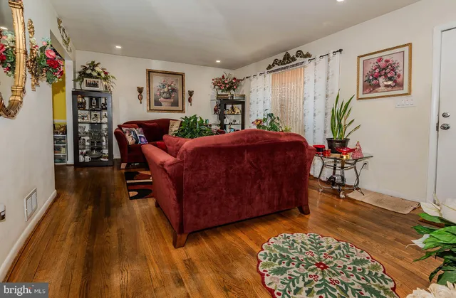 a living room with furniture and a rug
