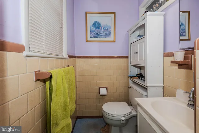a bathroom with a sink and toilet
