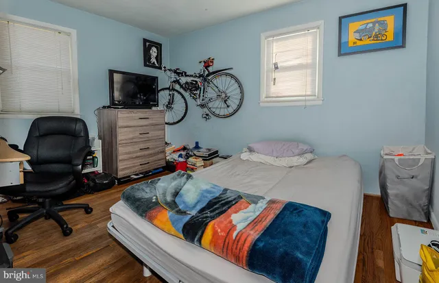 a bedroom with furniture and a window