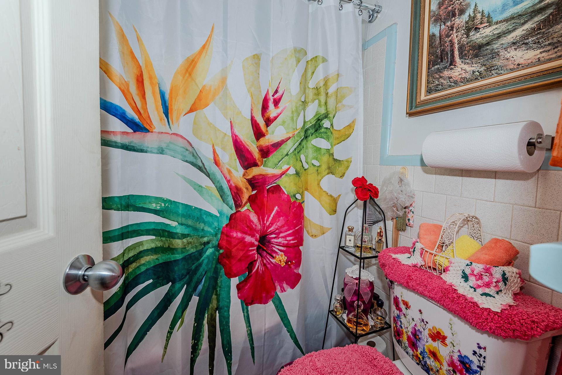 3505 South Forest Edge Road District Heights, MD 20747 - Photo 10 of 16 a vase of flowers sitting on a floor