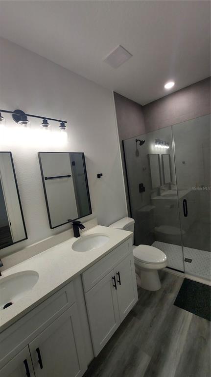 5984 Southwest 128th Street Road Ocala, FL 34473 - Photo 15 of 23 a bathroom with a sink a toilet and mirror