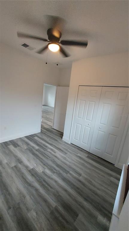 5984 Southwest 128th Street Road Ocala, FL 34473 - Photo 23 of 23 a view of empty room with wooden floor