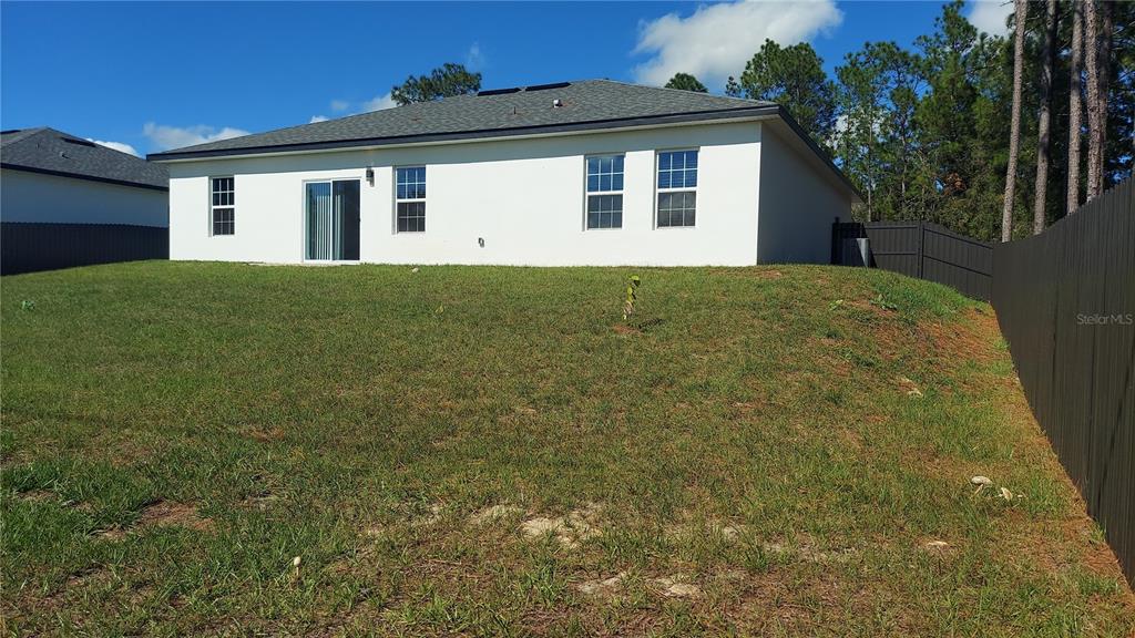 5984 Southwest 128th Street Road Ocala, FL 34473 - Photo 5 of 23 a front view of a house with a garden