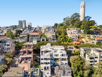a bathroom with a sink and mirror with toilet