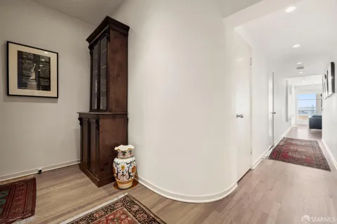 a view of a bathroom with a sink and a mirror