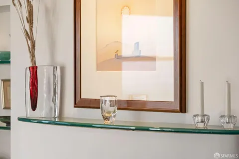 a kitchen with a stove and a chandelier