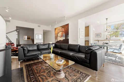 a view of a swimming pool with a table and chairs