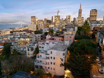 a dining room with furniture and a floor to ceiling window