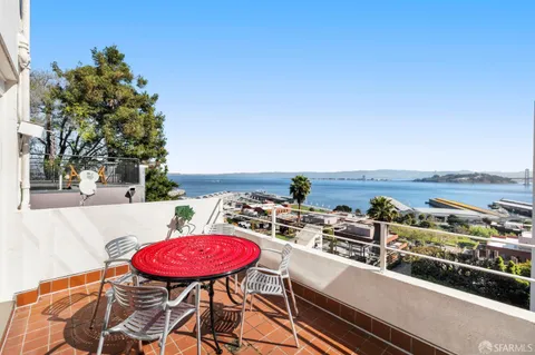 a stove top oven sitting inside of a kitchen