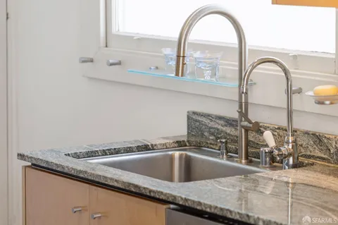 a white bath tub sitting next to a bathroom sink