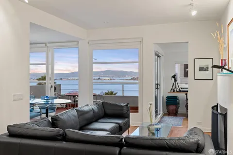 a view of a swimming pool with a table and chairs