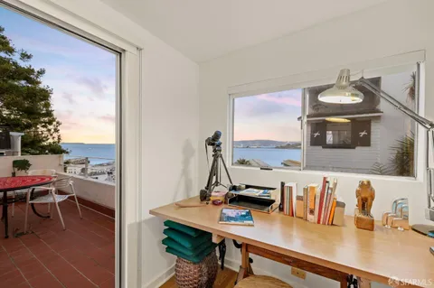 a view of a building with a tree