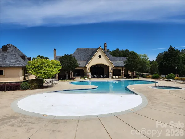 a view of swimming pool with outdoor seating