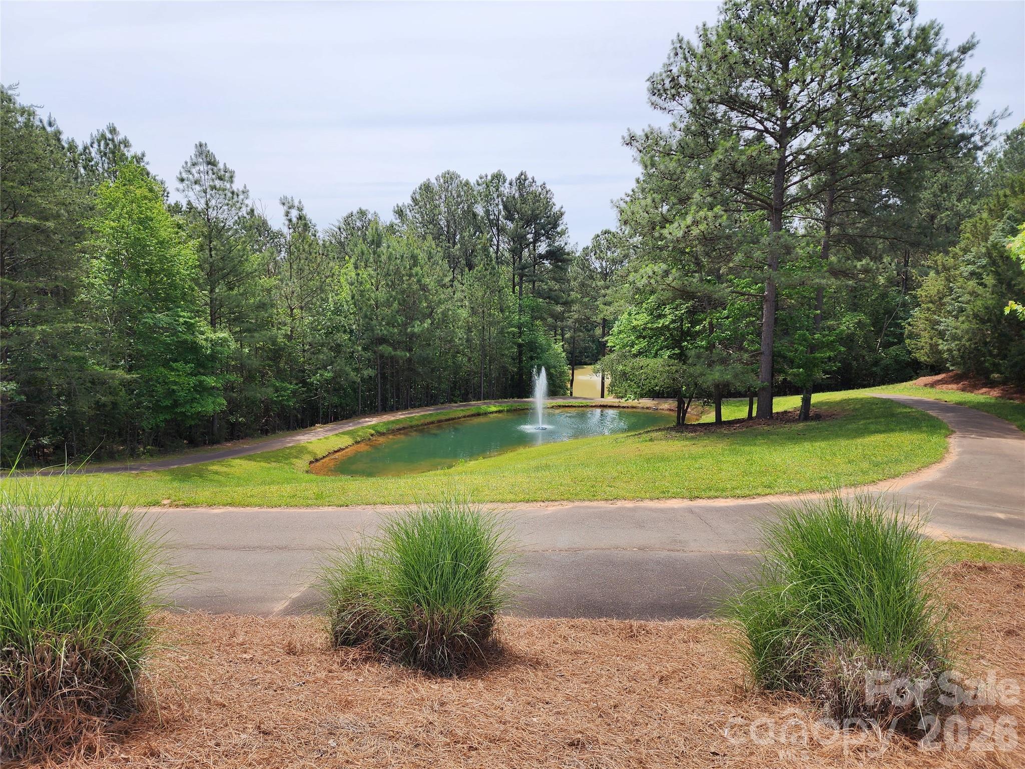 1510 Reflection Pointe Boulevard Belmont, NC 28012 - Photo 6 of 11 a view of a golf course with a park