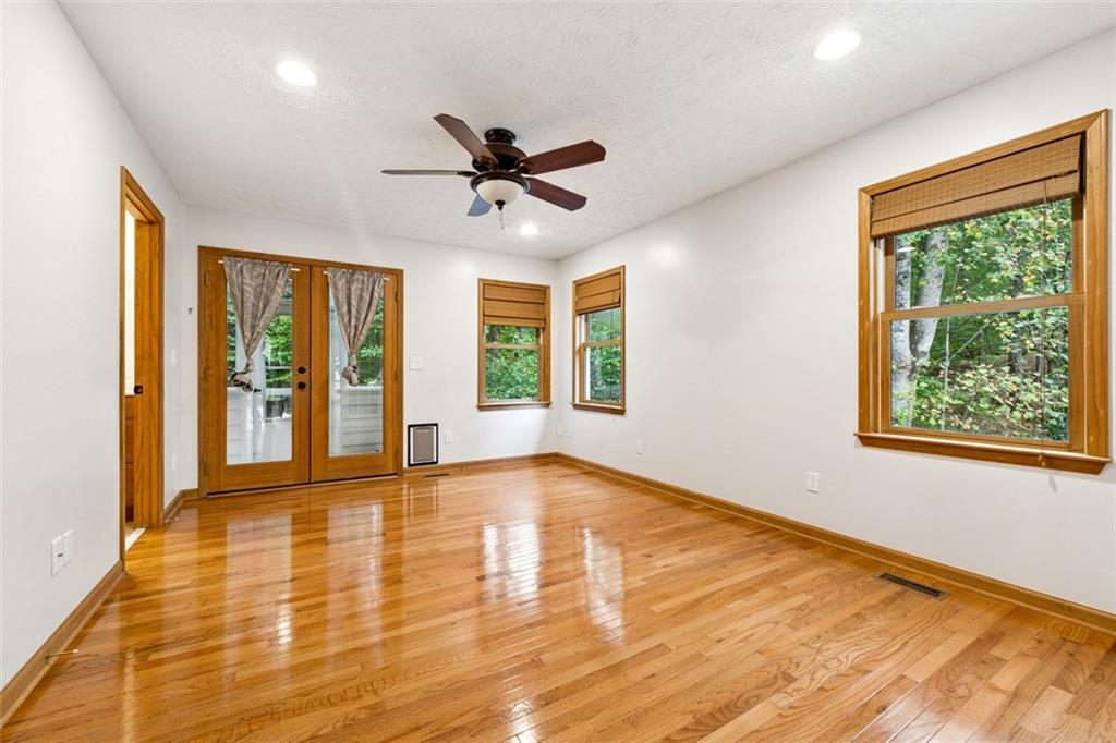 2017 Parsons Ridge Duluth, GA 30097 - Photo 18 of 53 a view of an empty room with a window and wooden floor