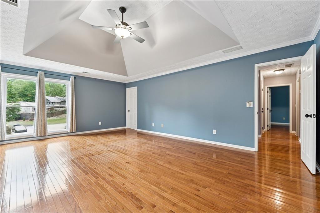 2017 Parsons Ridge Duluth, GA 30097 - Photo 23 of 53 a view of an empty room with window and wooden floor
