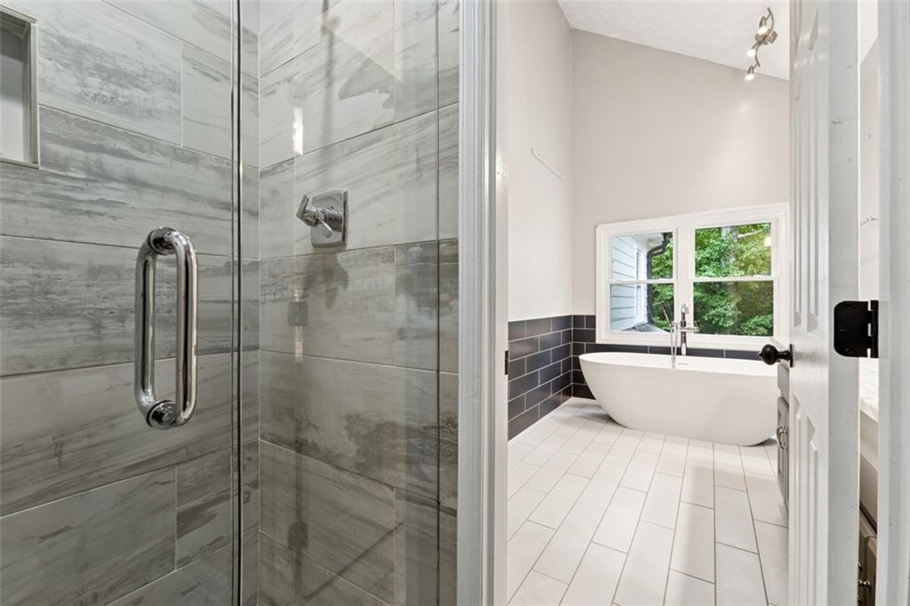 2017 Parsons Ridge Duluth, GA 30097 - Photo 25 of 53 a bathroom with a bathtub and shower