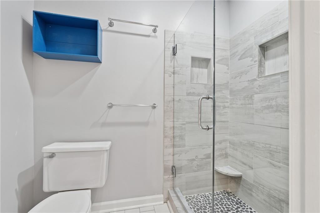 2017 Parsons Ridge Duluth, GA 30097 - Photo 26 of 53 a bathroom with a toilet and a shower