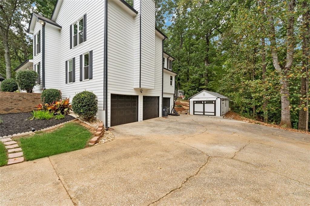 2017 Parsons Ridge Duluth, GA 30097 - Photo 3 of 53 a front view of a house with a yard and garage