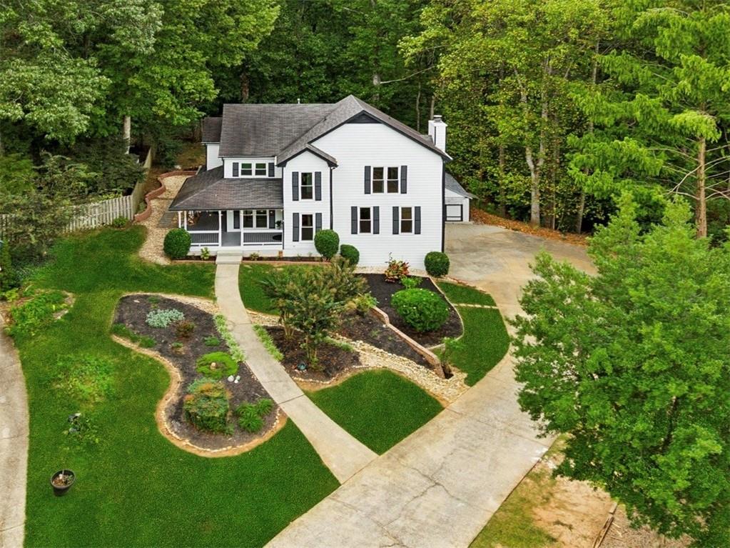 2017 Parsons Ridge Duluth, GA 30097 - Photo 47 of 53 a front view of a house with a yard and garage