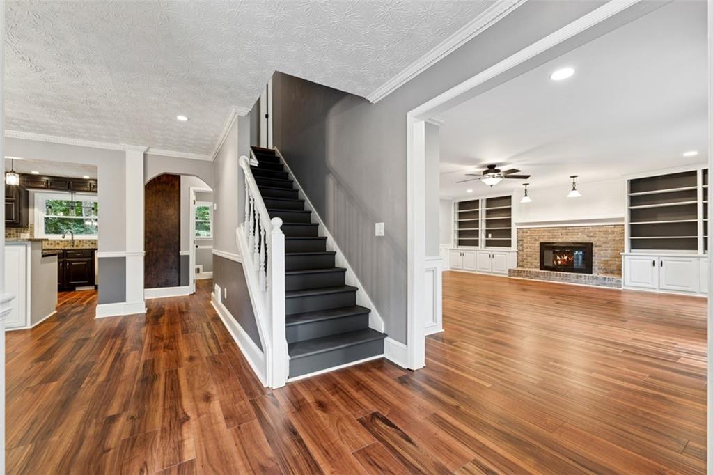 2017 Parsons Ridge Duluth, GA 30097 - Photo 6 of 53 a view of a living room with wooden floor and a fireplace