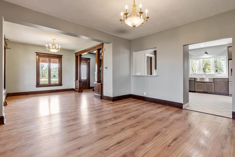 15685 West State Road Pecatonica, IL 61063 - Photo 11 of 69 an empty room with wooden floor and windows