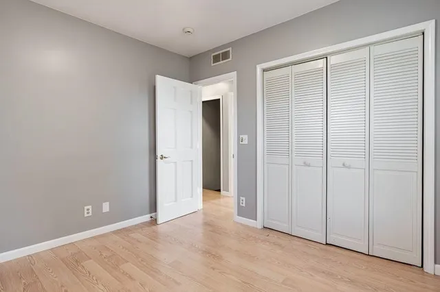 a bathroom with a sink toilet and a mirror