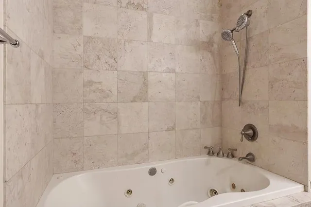 a bathroom with a granite countertop toilet a sink and mirror