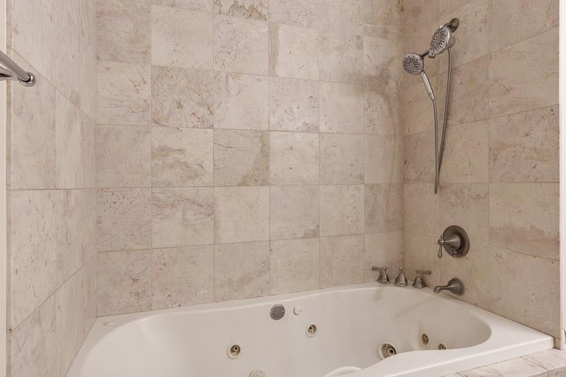 15685 West State Road Pecatonica, IL 61063 - Photo 37 of 69 a bathroom with a tub and a shower