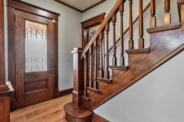 a view of an entryway with wooden floor
